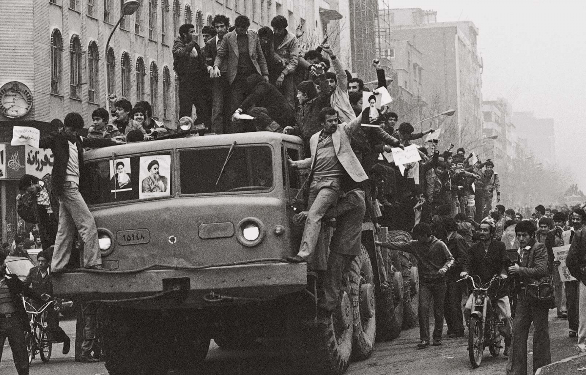  Dozens of demonstrators who have invaded an Iranian army truck, downtown on Wednesday, Jan. 17, 1979 in Tehran proceed in their joyful demonstration on the second day after the Shah‘s departure. 